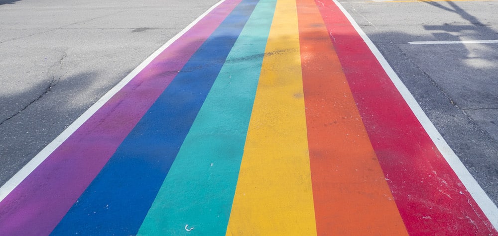 Rainbow coloured crosswalk for Pride Month on Church street in Toronto
